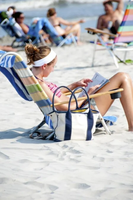 The holidays-included shift pattern (the operational breakthrough), shows a woman on holiday on the beach