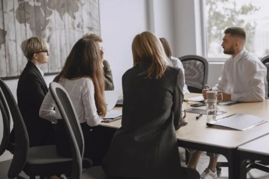 A small group of managers around a table